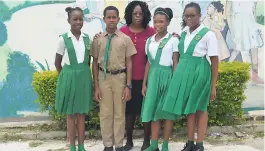  ?? CHRISTOPHE­R THOMAS PHOTO ?? Joan Brevitt (centre), principal of Harrison Preparator­y School in Montego Bay, with four of the school’s top GSAT students for 2018, (from left) Olivia Cunningham, Mario Allen, Jessica Brown and Khylie Rose.