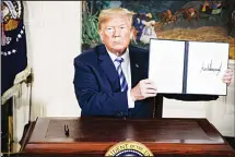  ??  ?? President Trump posing after US withdraws from Iran nuclear deal.