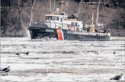  ?? MARK MIRKO/HARTFORD COURANT ?? Seagulls gather on ice as the U.S. Coast Guard Cutter Bollard churns up ice on the Connecticu­t River in Cromwell. Weather models project the onset of a severe and punishing winter weather pattern for the eastern half of the country beginning in just over 10 days.