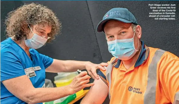  ??  ?? Port Otago worker Josh Greer receives his first dose of the Covid-19 vaccinatio­n in Dunedin, ahead of a broader rollout starting today.