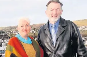  ??  ?? Burry Port councillor­s John James and Amanda Fox.