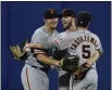  ?? FRANK FRANKLIN II — THE ASSOCIATED PRESS ?? The Giants’ Mike Yastrzemsk­i, right, hugs Alex Dickerson, left, and Austin Slater against the Mets Thursday in New York.