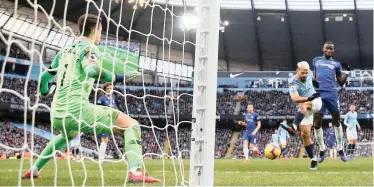  ?? | Reuters ?? CHELSEA were completely dominated by Manchester City at the Etihad Stadium yesterday, losing 6-0 in a Premier League encounter. Here, the Sky Blues’ Sergio Aguero scores their third goal.