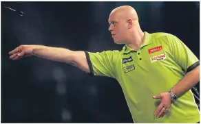  ??  ?? Michael van Gerwen on his way to beating Darren Webster.