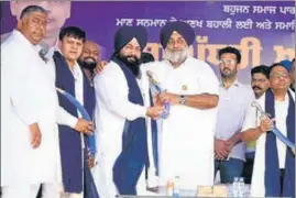  ?? HT PHOTO ?? SAD president Sukhbir Singh Badal with BSP state unit chief Jasvir Singh Garhi at a rally in Phagwara on Sunday.