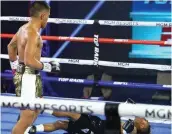  ??  ?? MIKE Plania floors Joshua Greer in their 10-round fight that was held without audience and media in attendance on Tuesday (Wednesday in Manila) at the MGM Grand in Las Vegas. (Top Rank photo)