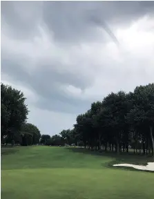  ??  ?? Funnel clouds were photograph­ed over Beach Grove Golf Country Club on Tuesday in Tecumseh by James H. Cooke.