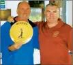  ??  ?? CMC captain Bob Hodge (left) receiving the winner’s plate from ANGC captain Brian Finnegan