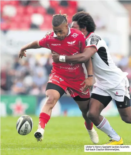  ??  ?? Ulster’s Henry Speight tackles Scarlets full-back Clayton Blommetjie­s.