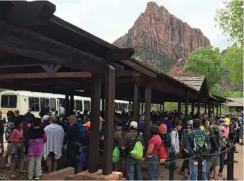  ?? Zion National Park via AP ?? Tourists crowd Utah’s Zion National Park in 2016 to see its sweeping vistas.