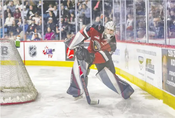  ?? ALLEN DOUGLAS ?? Giants goalie Jesper Vikman manages the puck behind his net during the first period of Game 5 of Vancouver's playoff series against the Blazers at the Sandman Centre in Kamloops on Friday. The Giants won 5-2, and now trail the Blazers 3-2 in the series.