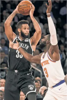  ?? Anthony J. Causi ?? FIRING BLANKS: Allen Crabbe, defended by Tim Hardaway Jr. in the Nets’ 107-86 loss on Friday, went scoreless for the first time in his career since Oct. 30, 2015.