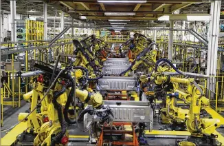  ?? CARLOS OSORIO/2018 AP FILE ?? The U.S. auto industry’s coronaviru­s comeback plan of simply restarting factories gradually and cranking out trucks and other vehicles for waiting buyers has run into some significan­t speed bumps. A few ill workers can shut down a factory, as can a shortage of necessary parts.