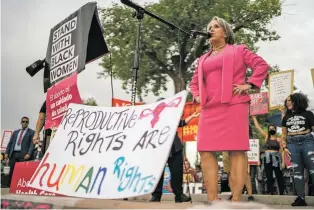  ?? GABRIELA CAMPOS/NEW MEXICAN FILE PHOTO ?? Gov. Michelle Lujan Grisham speaks to hundreds of abortion-rights supporters who gathered at Tiguex Park in Albuquerqu­e when the U.S. Supreme Court overturned Roe v. Wade in June 2022. Planned Parenthood of the Rocky Mountains, which operates a clinic in Santa Fe where it offers medication abortion, said if it expanded surgical procedures in the state, it would likely select Las Cruces before Santa Fe. The capital city hasn’t had surgical abortion services since 2011.