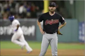  ?? LM OTERO — THE ASSOCIATED PRESS ?? Indians starting pitcher Josh Tomlin stands on the mound as the Rangers’ Adrian Beltre circles the bases after a home run in the fifth inning.