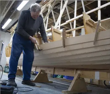  ??  ?? Terry Keogh at work on the boat at Bray Rowing Club’s premises on the seafront.