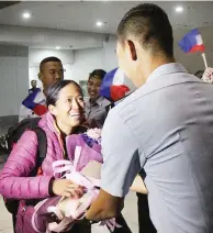  ??  ?? SEVEN SUMMITS CONQUEROR – Lieutenant junior grade Carina G. Dayondon of the Philippine Coast Guard, the Filipina mountainee­r who accomplish­ed the Seven Summits quest, arrives at the Ninoy Aquino Internatio­nal Airport (NAIA) Saturday. She is the first Filipina to scale the tallest peaks of the world’s continents. (Manny Llanes)