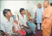  ?? SUBHANKAR CHAKRABORT­Y/ HT PHOTO ?? ▪ CM Yogi Adityanath interactin­g with kin of dog attack victims in Gurpaliya village in Sitapur on Friday.