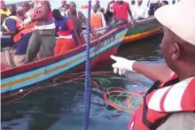  ?? Reuters ?? Rescue workers at the scene where a ferry overturned in Lake Victoria yesterday, Rescue operations were suspended overnight and hopes are fading on finding more survivors.