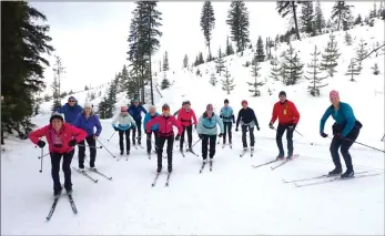  ?? ?? J.P. SQUIRE/Special to Okanagan Newspaper Group
Volunteer classic ski instructor Lisa Howard has her intermedia­te class practice “the gorilla” while pausing on Log Cabin Trail. Practising that stance with a “grrrrr” teaches everyone to lean forward and “lead with your heart.”