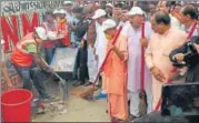  ?? HT PHOTO ?? CM Yogi Adityanath wielded the broom during the Clean UP Healthy UP’ sanitation drive in Gorakhpur on Saturday. P5