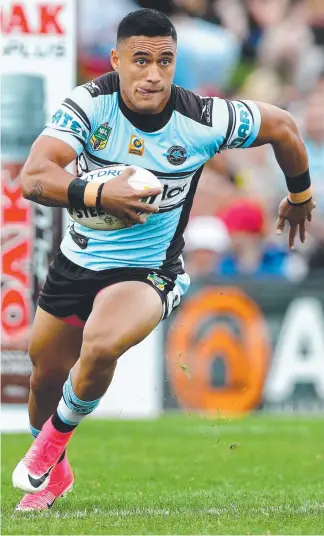  ??  ?? Valentine Holmes (above) will factor into Kevin Walters’ (right) Origin calculatio­ns. ROBERT CRADDOCK