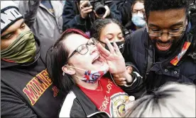  ??  ?? Courtney Ross, George Floyd’s girlfriend, reacts to the verdict, outside the Hennepin County Government Center in Minneapoli­s on Tuesday.