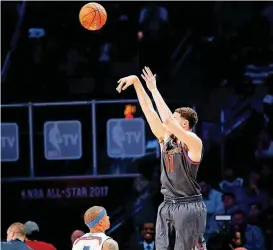  ?? [AP PHOTO] ?? Western Conference guard Klay Thompson of the Golden State Warriors, right, shoots over Eastern Conference guard Isaiah Thomas of the Boston Celtics during Sunday night’s NBA All-Star Game in New Orleans.