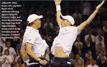  ??  ?? JUBILANT: Mike Bryan, left, and Bob Bryan of US celebrate winning against Britain's Dominic Inglot and Jamie Murray during the Davis Cup third round doubles tennis match at the Emirates Arena in Glasgow, Scotland on Saturday. (AFP)