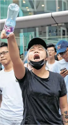  ?? PHOTO: SUSANA VERA ?? Challenge: An anti-government protester shouts at police during a protest in the Tsuen Wan district.