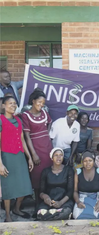  ??  ?? 0 Unison’s Gordon Mackay, front right, with staff and patients at the maternity