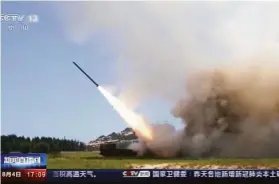  ?? China Central Television ?? A Chinese television station shows a projectile launched from an unspecifie­d location as part of military exercises that have raised tensions in the region.