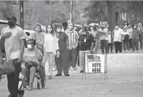  ?? MICHAEL HOLAHAN/ USA TODAY NETWORK ?? Monday was the first day for advance voting in Georgia, and hundreds showed up to cast their ballot early in Augusta.