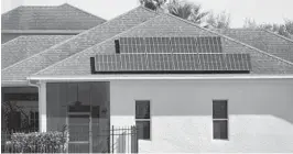  ?? JOE BURBANK/ORLANDO SENTINEL ?? A home off of Hartwood-Marsh Road in Clermont equipped with solar panels on Jan. 6. Last week, Gov. Ron DeSantis vetoed a bill championed by FPL.