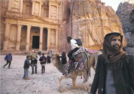  ??  ?? Camels, horses and donkeys carry tourists in Petra but their treatment has angered animal rights groups Salah Malkawi for The National