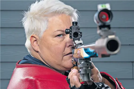  ??  ?? Target: Lorraine Lambert is hoping to win a medal in the 50m rifle competitio­n after being fitted with a special bra (below) which ensures her body cannot come into contact with her gun