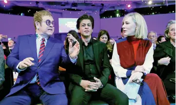  ??  ?? John (left to right), Khan and Blanchett are pictured at the Crystal Awards ceremony of the annual meeting of the World Economic Forum (WEF) in Davos, Switzerlan­d on Monday. (Below) Blanchett receives a Crystal Award from Hilde Schwab, Chairperso­n and...