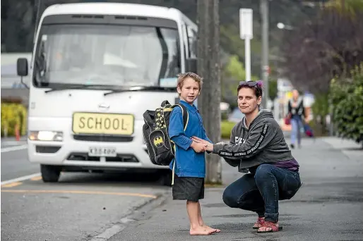  ?? PHOTOS: BRADEN FASTIER/STUFF ?? Amy StuartForb­es with her son Jack, who has been barred from travelling on the school bus to Murchison Area School, meaning she has to drive nearly 100 kilometres each day. The Ministry of Education has assessed Jack as being unsafe to travel on the bus, but Stuart-Forbes and the school are fighting the decision.