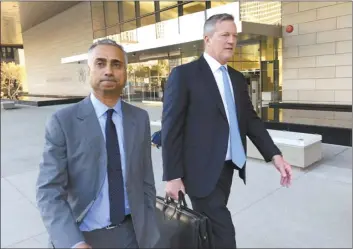  ?? AP photo ?? Imaad Zuberi (left) leaves the federal courthouse in Los Angeles with his attorney Thomas O’Brien after pleading guilty to funneling donations from foreigners to U.S. political campaigns. Zuberi, an elite political fundraiser, had the ear of top Democrats and Republican­s alike — a reach that included private meetings with then-Vice President Joe Biden and VIP access at Donald Trump’s inaugurati­on. But federal prosecutor­s say Zuberi’s life was built on a series of lies and the lucrative enterprise of filling the campaign coffers of American politician­s and profiting from the resulting influence. They describe him as a “mercenary” political donor who gave to anyone — often using foreign money given through illegal straw donors.