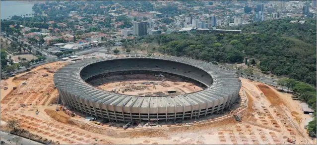  ?? WASHINGTON ALVES/ REUTERS ?? An aerial view shows the renovation work on Magalhaes Pinto soccer stadium, also known as Mineirao stadium, that will be used when Brazil hosts the 2014 World Cup.