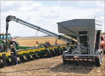  ?? David Joles Minneapoli­s Star Tribune ?? COMMODITY prices have already jumped from their spring lows. Copper, iron ore and soybeans have risen to their highest levels in six- plus years, spurred by a Chinese buying spree. Above, a soybean farm in Minnesota.