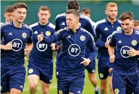  ?? ?? Leading men: Kieran Tierney (left), Callum McGregor (centre) and Billy Gilmour (right) prepare for tonight’s match