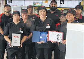  ??  ?? Restaurant general manager Nga Lewis (centre front) and some of her award-winning crew at KFC Kaitaia.