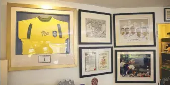  ??  ?? Grimes' gym is a sports fanatic’s heaven with all the sports memorabili­a hanging on the walls.