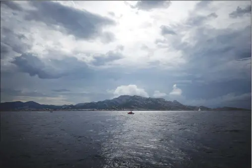  ?? (AP/Pool/Daniel Cole) ?? The view from the 7th Continent expedition sailing ship is shown Friday as French President Emmanuel Macron and a delegation go to admire the Calanques National Park, a marine reserve known for its azure blue waters overhung by high white cliffs, near Marseille, France.