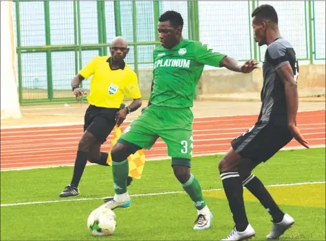  ??  ?? THE BALL IS MINE ... FC Platinum’s Farai Madhanhang­a (left) shields the ball away from Ronald Rajaonariv­elo of CNaPS during yesterday’s match in Antananari­vo