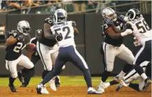  ?? Santiago Mejia / The Chronicle ?? Raiders running back Marshawn Lynch (left) got his first action of the preseason, playing one series against the Rams.