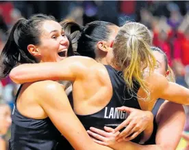  ?? Photo / Getty Images ?? An overjoyed Ameliarann­e Ekenasio (left) and Laura Langman embrace after the Silver Ferns’ World Cup-winning performanc­e.