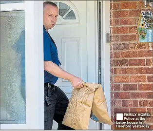  ??  ?? FAMILY HOME: Police at the Letby house in Hereford yesterday