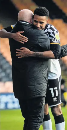  ??  ?? JOB DONE: Cristian Montano celebrates the three points with assistant manager Dave Kevan.